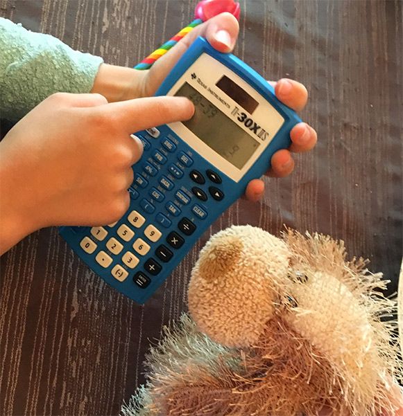 Wanda explaining her 2nd grade math to Tom the Dog.