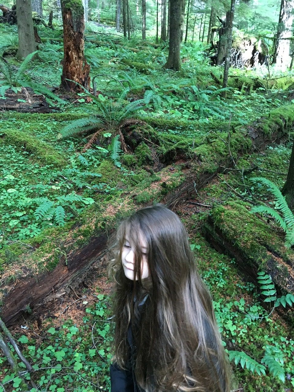 My daughter Wanda in a lush, mossy forest. 