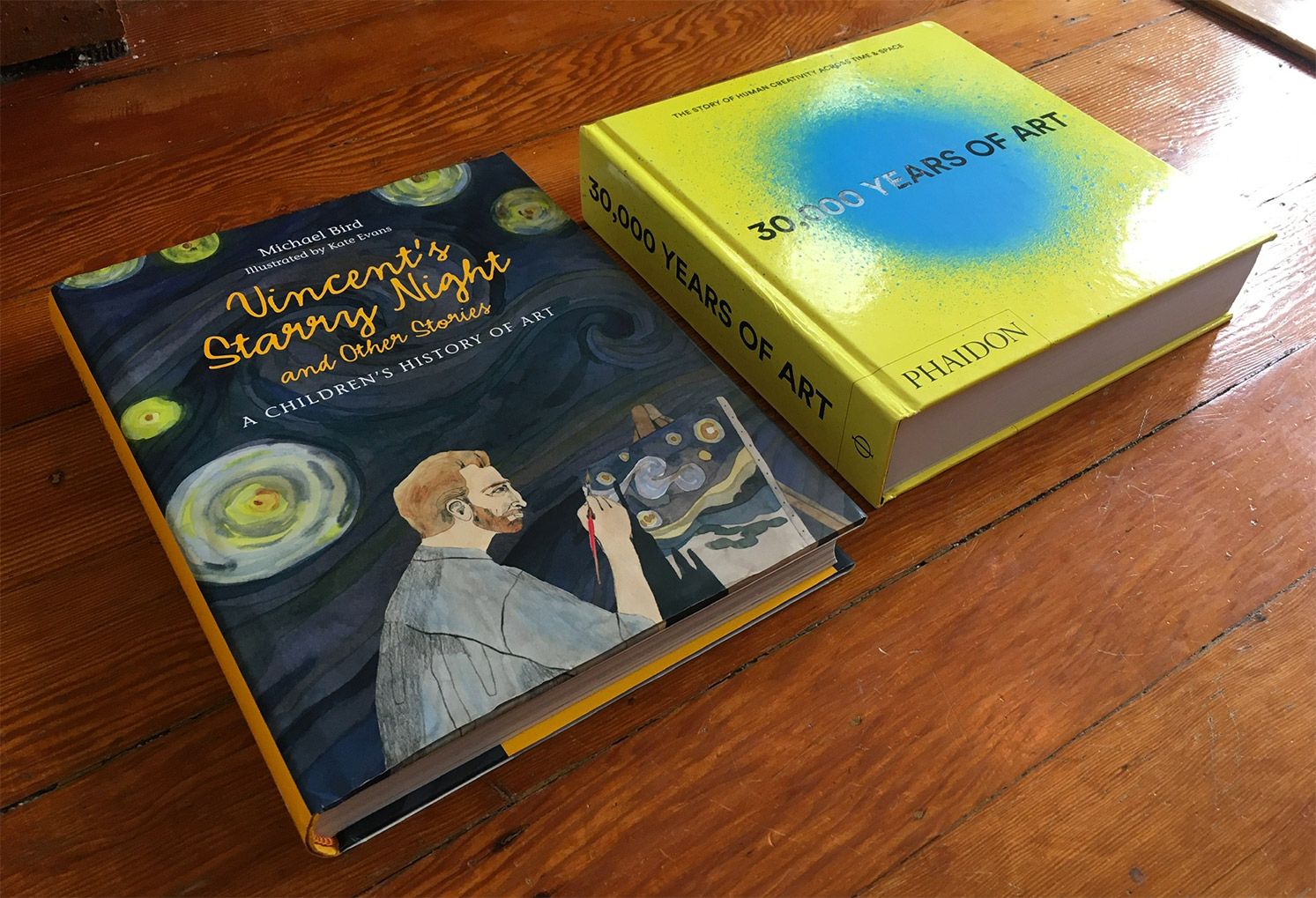 The two books are shown from another angle, to show the thickness of the books. They're chonky!