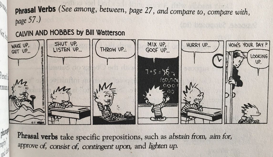 Black text on a white page defining phrasal verbs, paired with a Calvin & Hobbes comic strip demonstrating them.