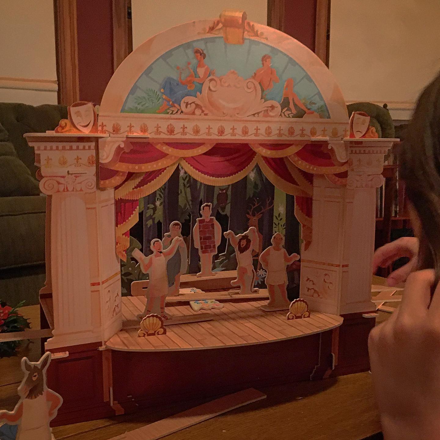 A small model of a theater for kids, made from printed foam boards put together, with characters from A Midsummer Night's Dream.