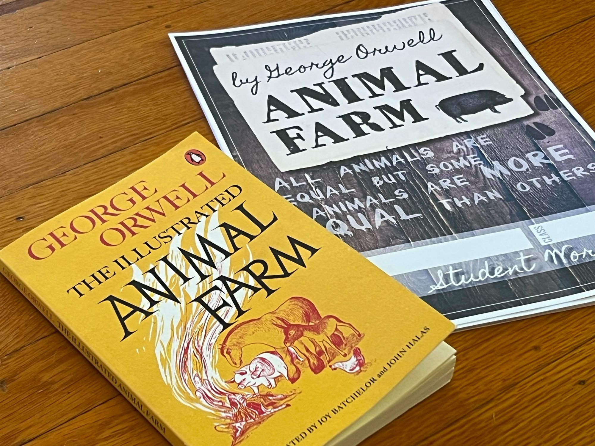 Our yellow Animal Farm paperback, and our student workbook.