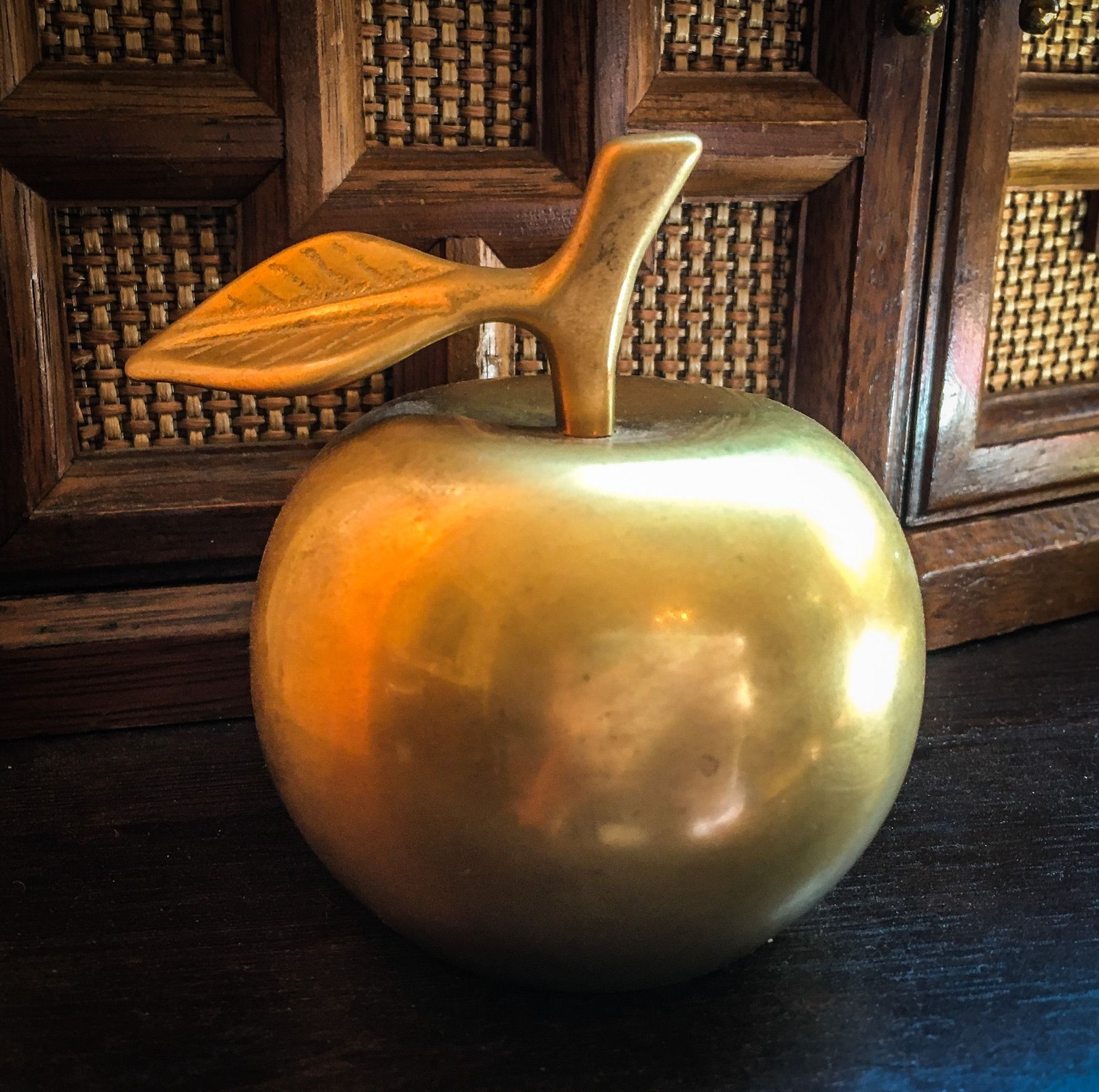 Vintage brass bell in the shape of an apple
