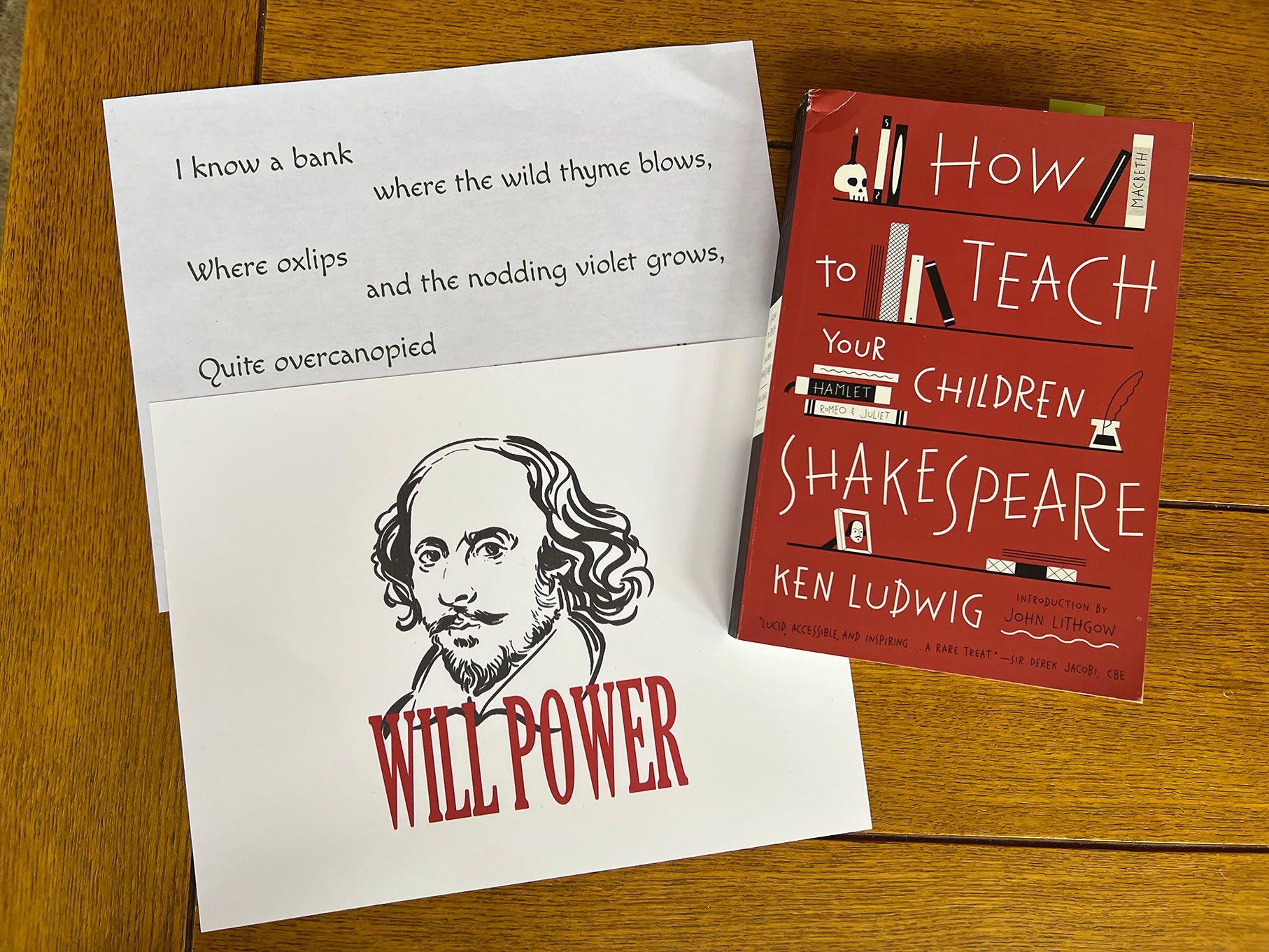 A book, "How to Teach Your Children Shakespeare," some lines from a play, and a picture of Shakespeare that says WILL POWER.
