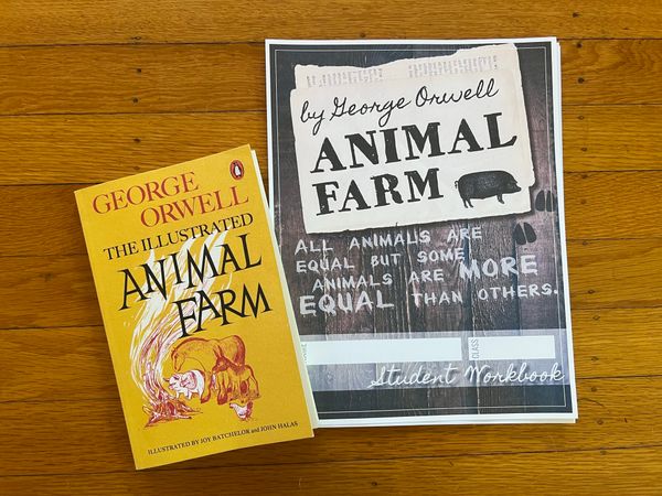 A bright yellow Animal Farm paperback book with cartoon drawings of farm animals, and a student workbook.